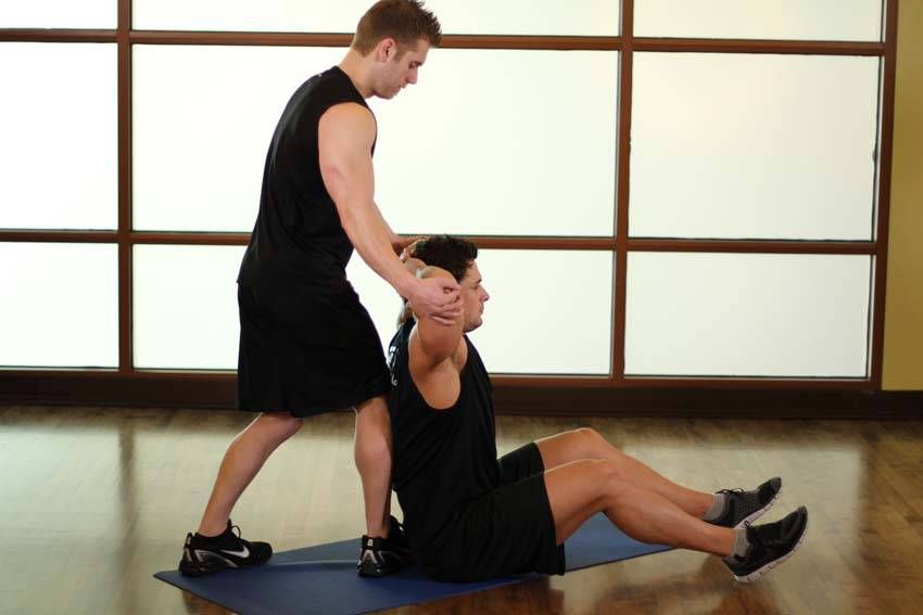 Behind-the-Head Chest Stretch exercise demonstration, targeting the chest