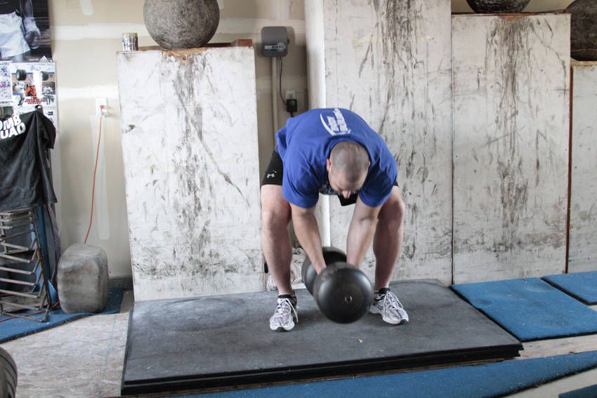 Circus Dumbbell Press exercise demonstration, targeting the shoulders