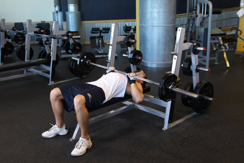 Close-Grip Bench Press exercise demonstration, targeting the triceps