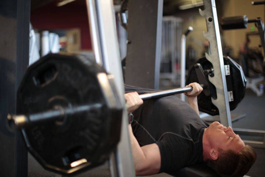 Decline Smith Machine Press exercise demonstration, targeting the chest
