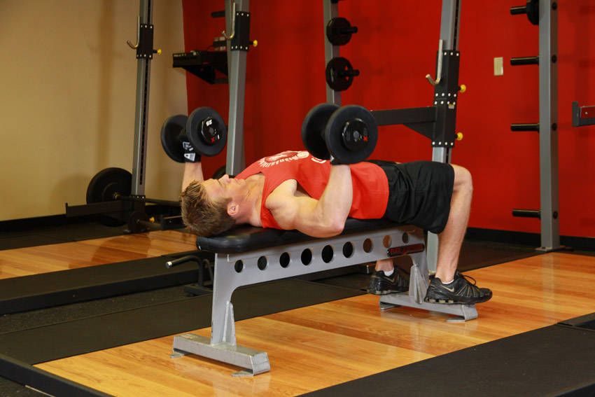 Dumbbell Bench Press exercise demonstration, targeting the chest