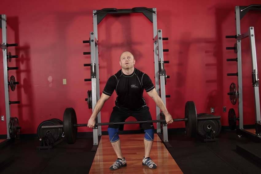 Hang Snatch exercise demonstration, targeting the quads