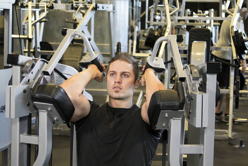 Machine Tricep Extension exercise demonstration, targeting the triceps