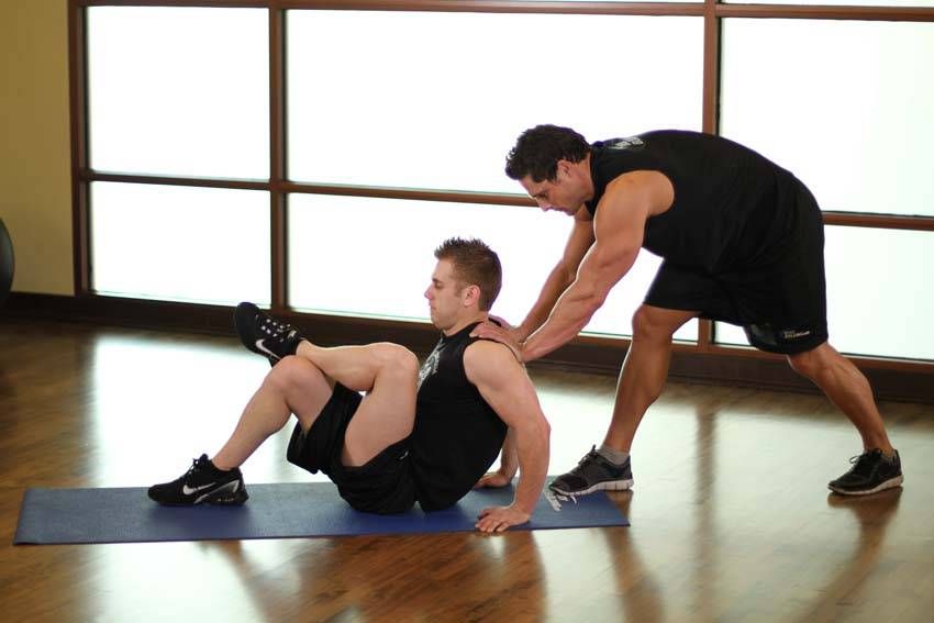 Seated Glute Stretch exercise demonstration, targeting the glutes