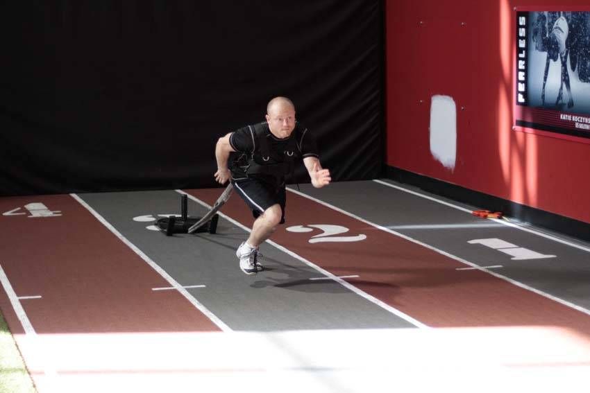 Sled Drag (Harness) exercise demonstration, targeting the quads