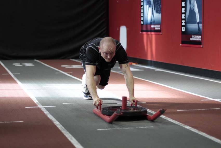 Sled Push (Prowler) exercise demonstration, targeting the quads