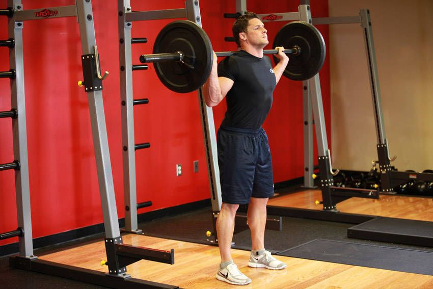 Barbell Back Squat exercise demonstration, targeting the quads