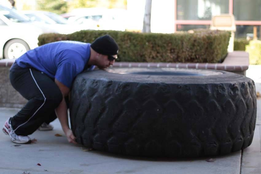 Tire Flip exercise demonstration, targeting the quads